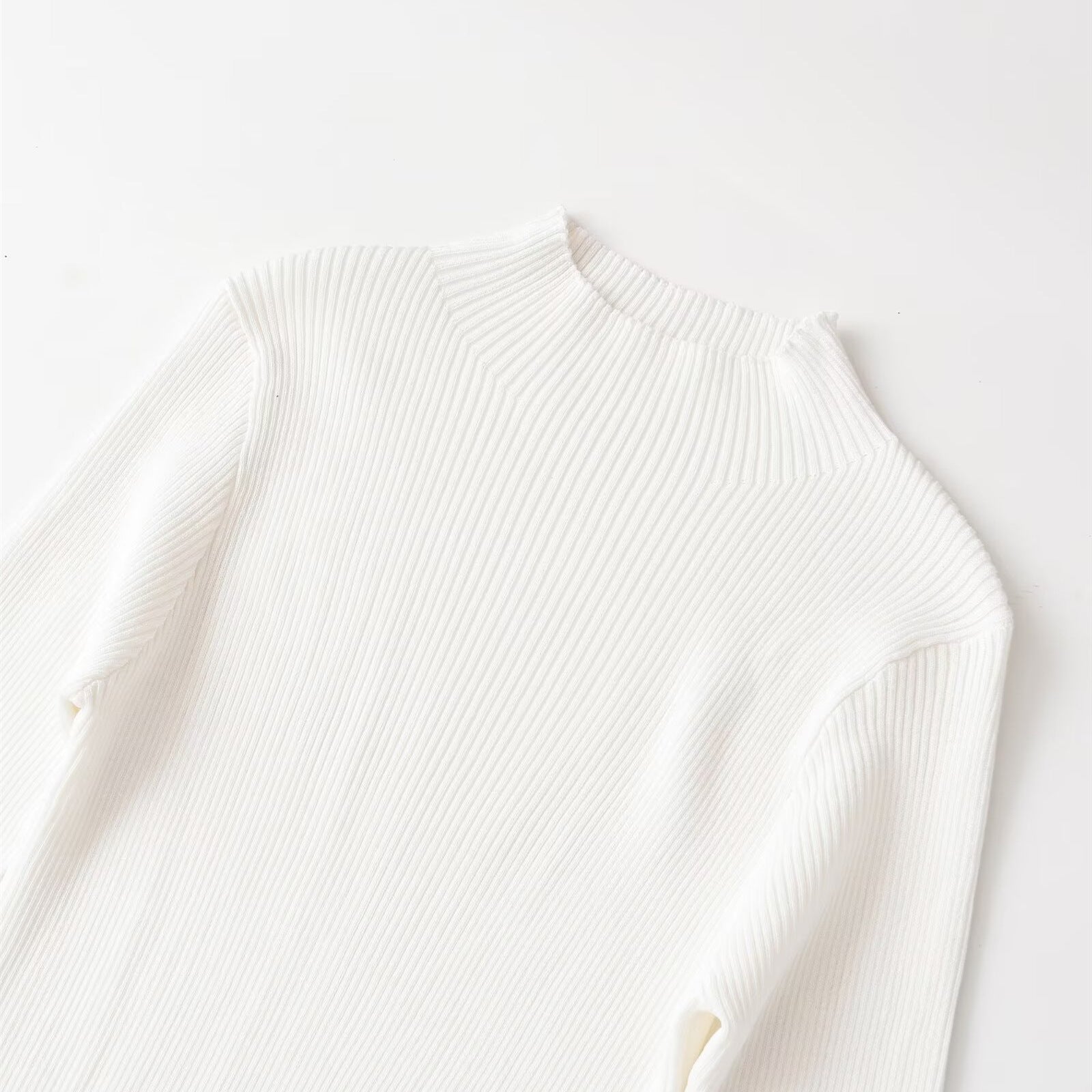 Long sleeved high neck wavy ribbed knitted dress
